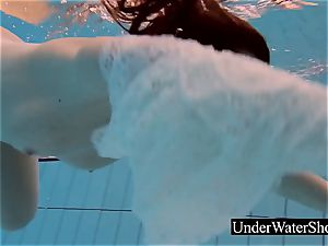 jaw-dropping ginger-haired in the white sundress underwater